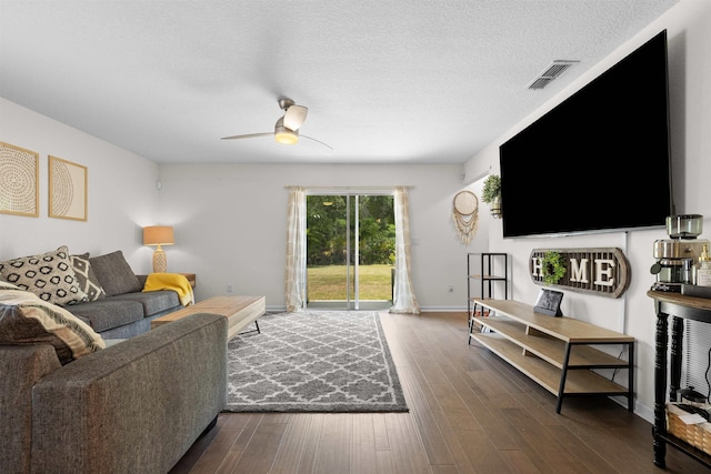 121 Sawmill Forest Ct, Saint Augustine, FL 32086 - living room with ceiling fan, a textured ceiling, dark wood finished floors, baseboards, and visible vents