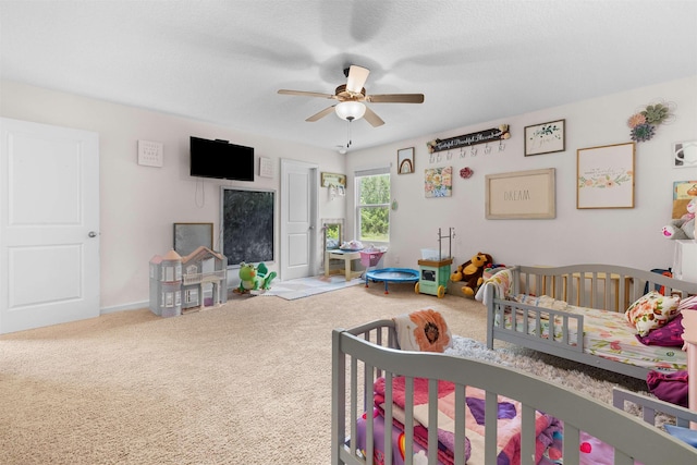 121 Sawmill Forest Ct, Saint Augustine, FL 32086 - carpeted bedroom featuring a ceiling fan, baseboards, and a crib