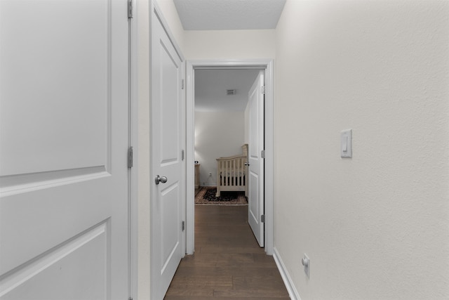 121 Sawmill Forest Ct, Saint Augustine, FL 32086 - corridor with visible vents and dark wood-type flooring