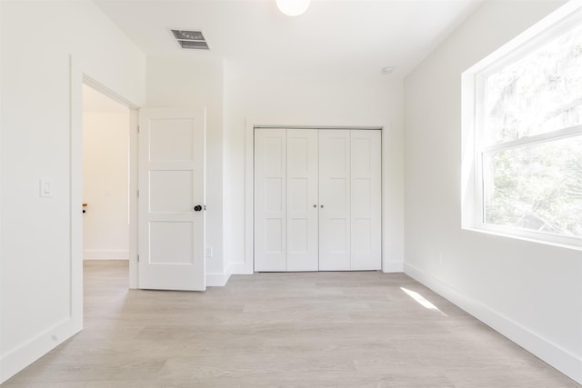 974 Alexander St, Saint Augustine, FL 32084 - unfurnished bedroom with light wood-style floors and a closet