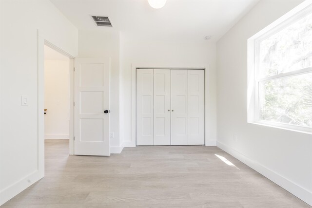 974 Alexander St, Saint Augustine, FL 32084 - unfurnished bedroom with light wood-style floors and a closet