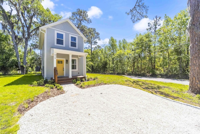 974 Alexander St, Saint Augustine, FL 32084 - view of front facade featuring covered porch and a front yard