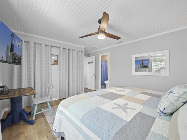 bedroom featuring hardwood / wood-style flooring, ceiling fan, crown molding, and connected bathroom