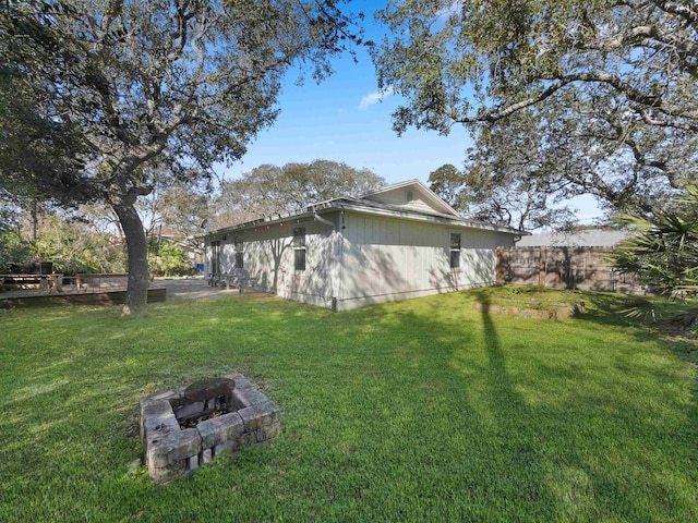 view of yard with an outdoor fire pit