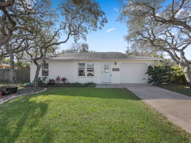 single story home featuring a front lawn and a garage