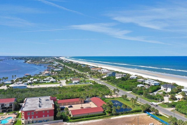 bird's eye view featuring a view of the beach and a water view