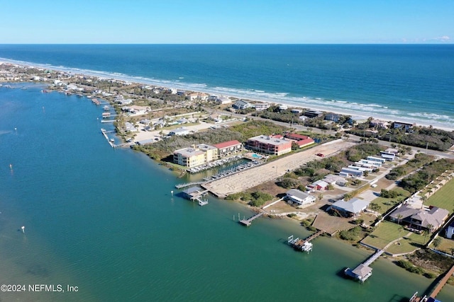 aerial view featuring a water view and a view of the beach