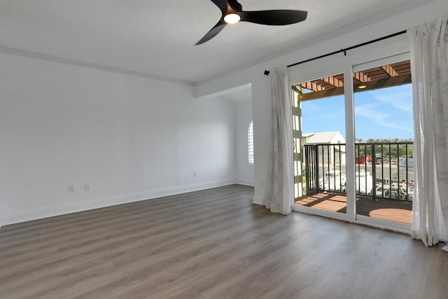 unfurnished room with hardwood / wood-style floors, a textured ceiling, and ceiling fan