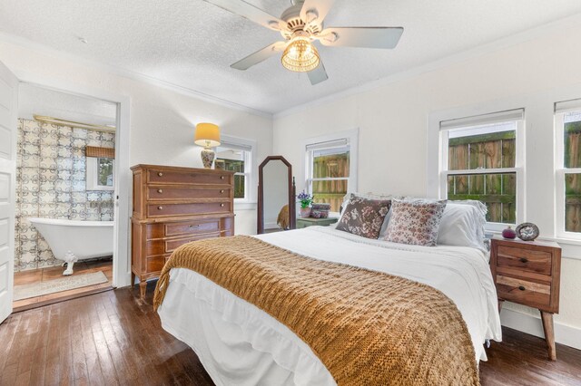 29 Oak St, Saint Augustine, FL 32084 - bedroom featuring dark wood-style floors, ornamental molding, ceiling fan, and a textured ceiling