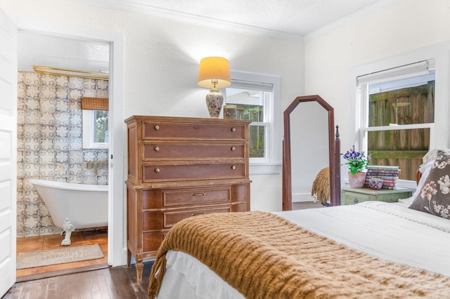 29 Oak St, Saint Augustine, FL 32084 - bedroom with ornamental molding and hardwood / wood-style floors