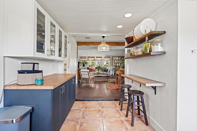 29 Oak St, Saint Augustine, FL 32084 - bar featuring a textured wall, recessed lighting, baseboards, light tile patterned floors, and pendant lighting