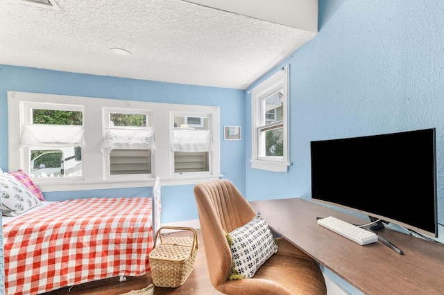 29 Oak St, Saint Augustine, FL 32084 - bedroom featuring a textured ceiling, a desk, and a textured wall