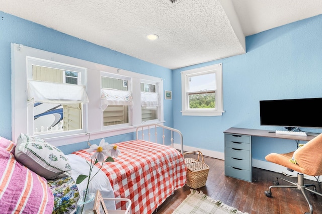 29 Oak St, Saint Augustine, FL 32084 - bedroom with hardwood / wood-style flooring, baseboards, and a textured ceiling