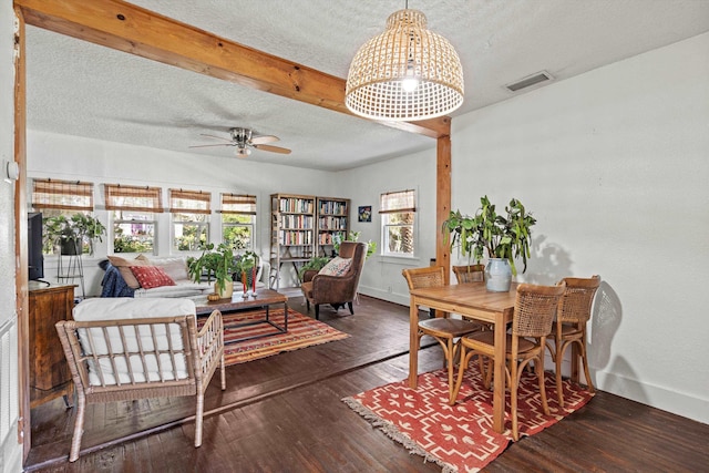 29 Oak St, Saint Augustine, FL 32084 - dining room featuring a textured ceiling, wood finished floors, a ceiling fan, and baseboards