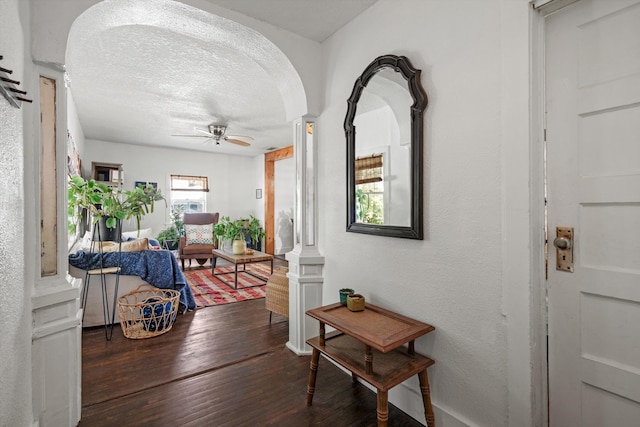 29 Oak St, Saint Augustine, FL 32084 - corridor featuring wood finished floors, arched walkways, and a textured ceiling