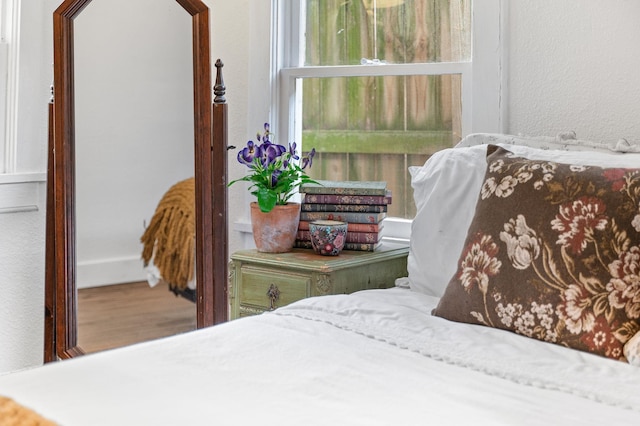 29 Oak St, Saint Augustine, FL 32084 - bedroom featuring a textured wall and wood finished floors