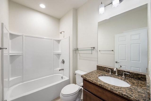 full bathroom featuring bathtub / shower combination, vanity, and toilet