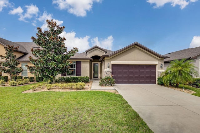 view of front of home featuring a front yard and a garage