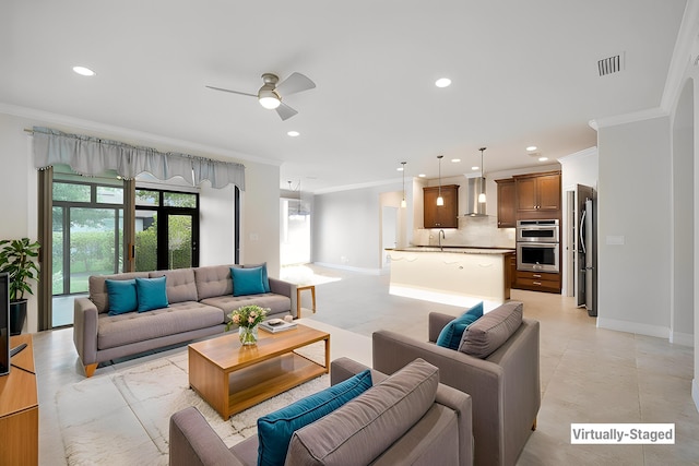 living room with recessed lighting, visible vents, ornamental molding, and a ceiling fan