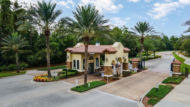 view of property's community with curved driveway