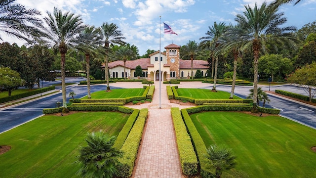 view of property's community with a lawn