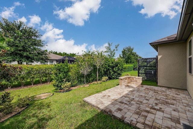 view of yard featuring a patio area and fence