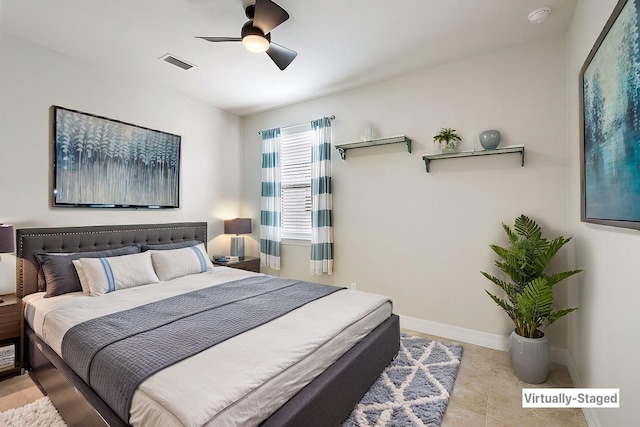 bedroom featuring visible vents, baseboards, and a ceiling fan