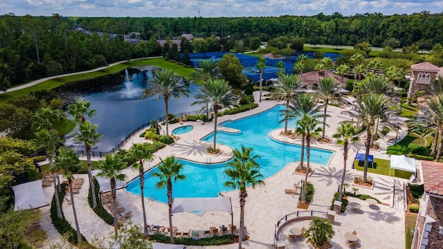 view of pool featuring a forest view