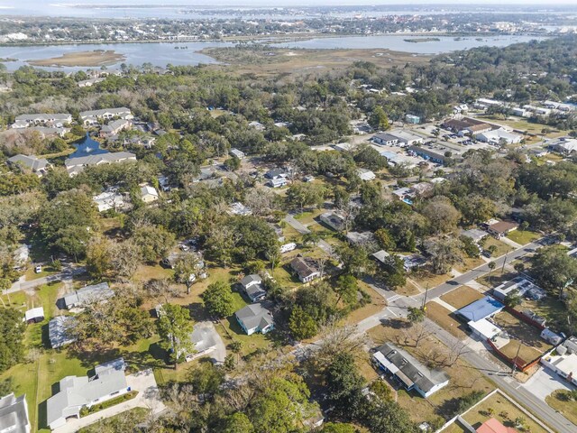 drone / aerial view with a water view and a residential view