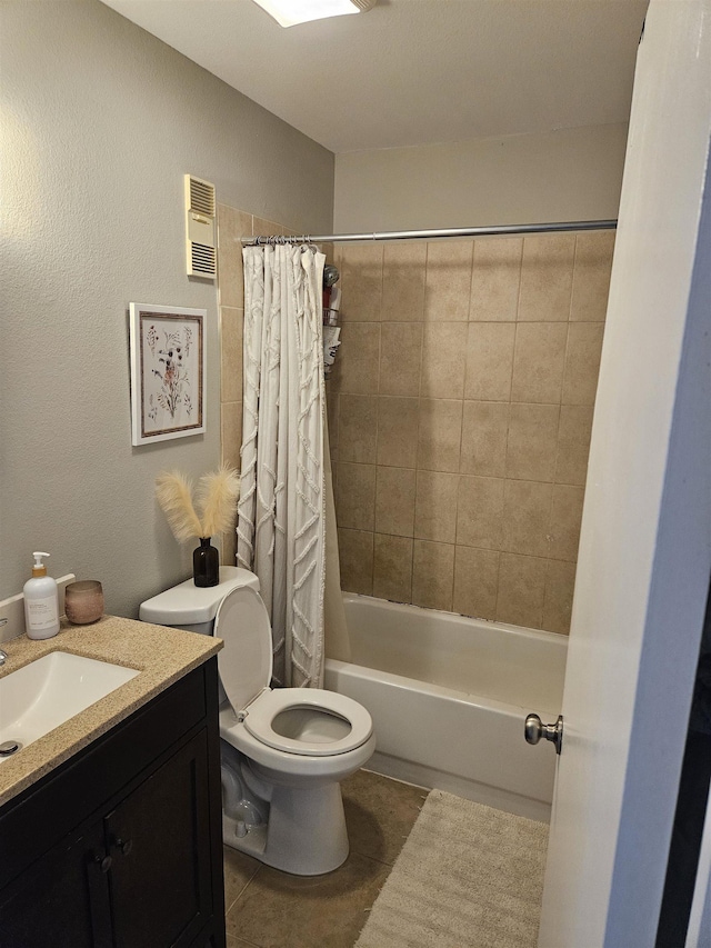 full bathroom featuring toilet, vanity, shower / tub combo with curtain, and tile patterned flooring