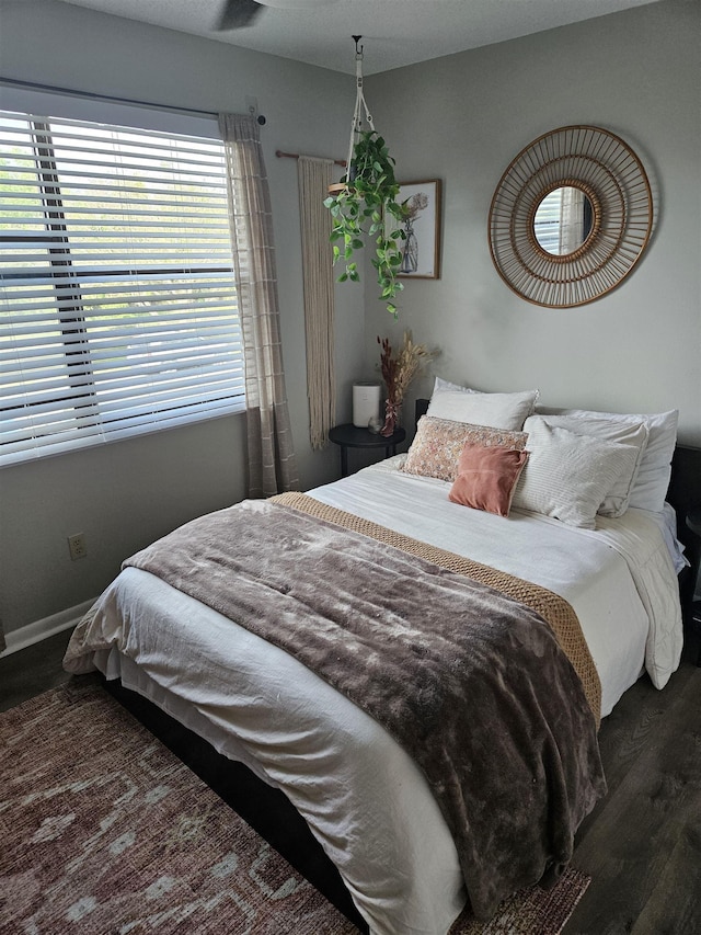 bedroom featuring dark hardwood / wood-style flooring