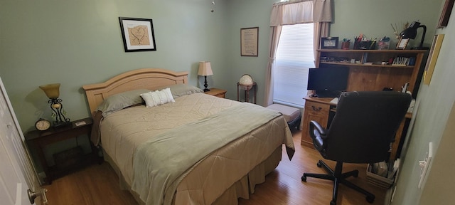 bedroom featuring hardwood / wood-style floors