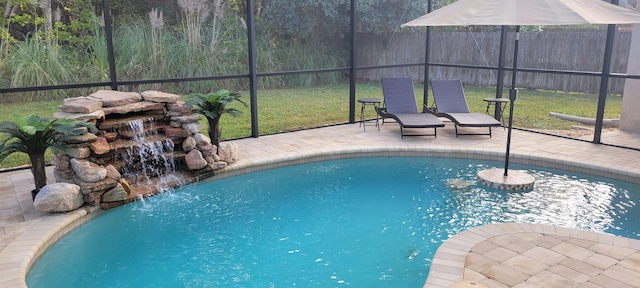 view of pool featuring a yard, pool water feature, and a patio