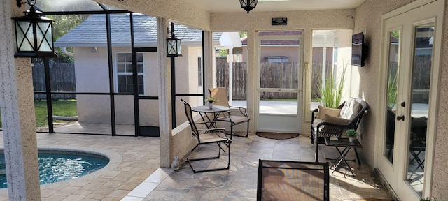 sunroom / solarium featuring a pool