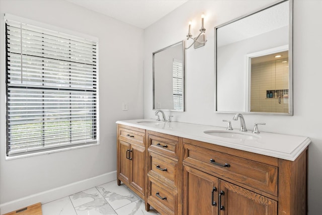 200 Raintree Trl, Saint Augustine, FL 32086 - bathroom featuring double vanity and marble look tile flooring