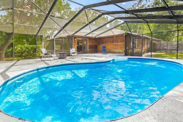 200 Raintree Trl, Saint Augustine, FL 32086 - swimming pool featuring a patio and glass enclosure