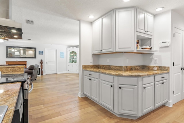 200 Raintree Trl, Saint Augustine, FL 32086 - kitchen with stainless steel range with electric cooktop, light wood-style floors, a textured ceiling, open shelves, and recessed lighting