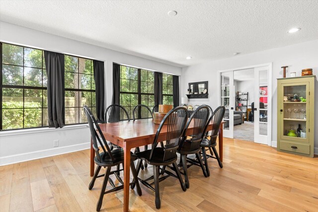 200 Raintree Trl, Saint Augustine, FL 32086 - dining room featuring a textured ceiling, light wood-style flooring, and recessed lighting