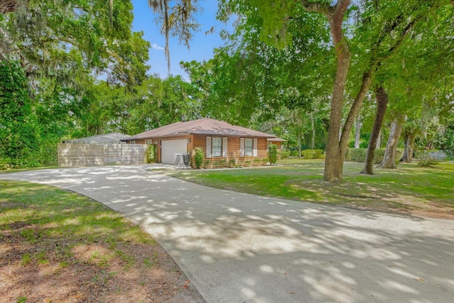 200 Raintree Trl, Saint Augustine, FL 32086 - view of front of house featuring a garage, concrete driveway, and a front lawn