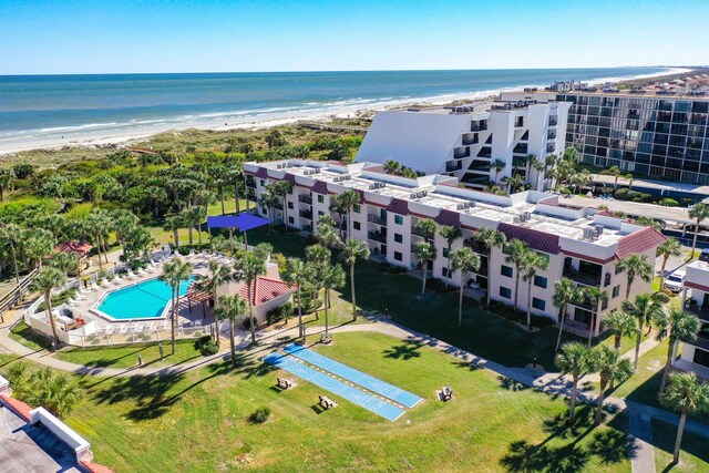 drone / aerial view with a water view and a view of the beach