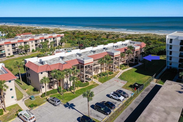 birds eye view of property featuring a water view and a view of the beach