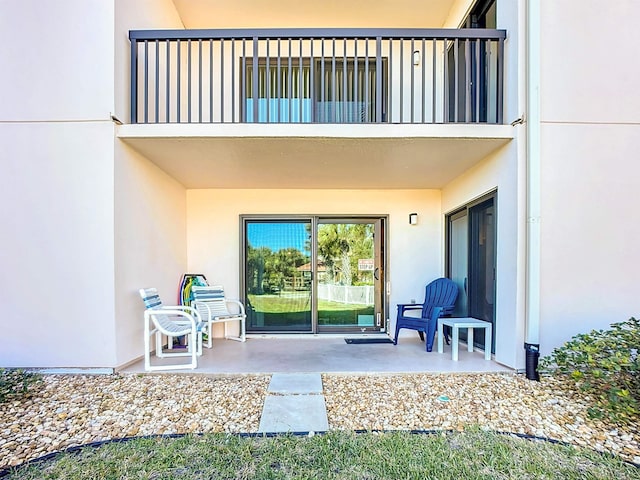 view of patio with a balcony