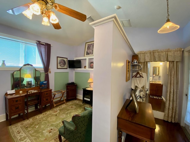 interior space featuring hardwood / wood-style floors and vaulted ceiling