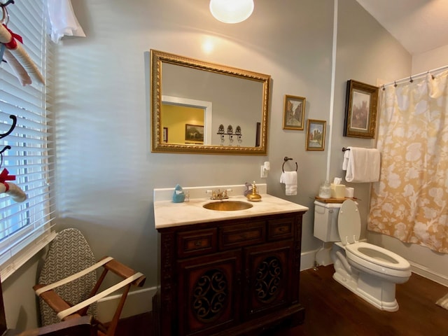 full bathroom with vanity, toilet, shower / tub combo with curtain, and wood-type flooring