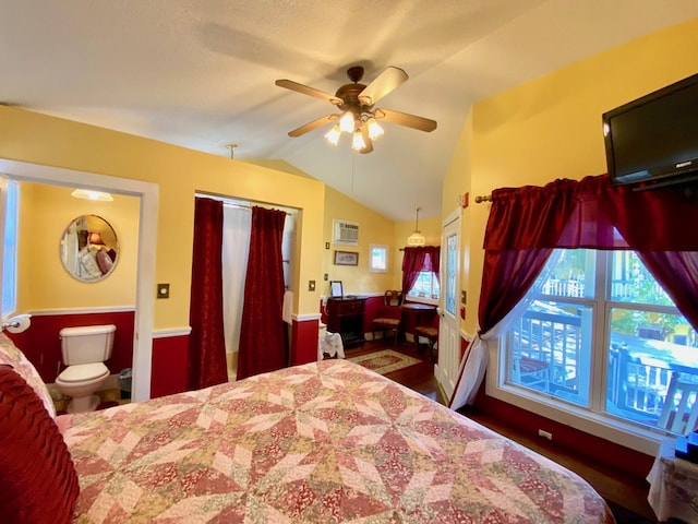 bedroom with ceiling fan, a wall mounted air conditioner, and vaulted ceiling