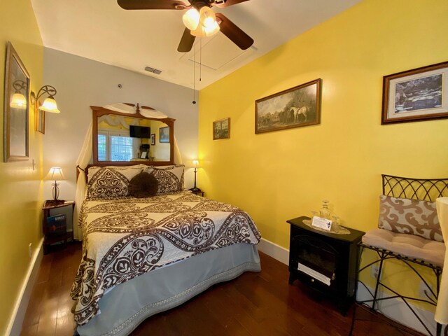 bedroom featuring ceiling fan and dark wood-type flooring