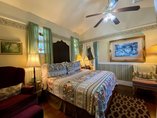 bedroom featuring ceiling fan, hardwood / wood-style floors, and lofted ceiling