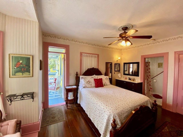 bedroom featuring ceiling fan, access to outside, dark wood-type flooring, and a textured ceiling