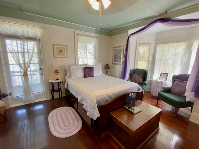 bedroom with ceiling fan, access to outside, and dark hardwood / wood-style flooring