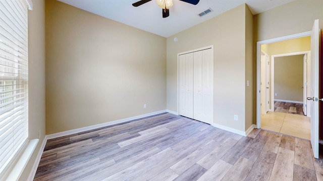 61 Grey Hawk Dr, Saint Augustine, FL 32092 - unfurnished bedroom featuring light wood finished floors, a closet, and ceiling fan